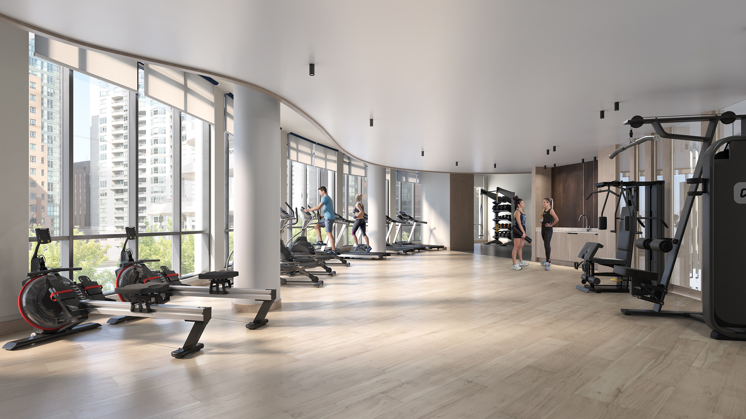 Relevé Gym features a spacious workout area filled with exercise equipment and large windows for natural light.