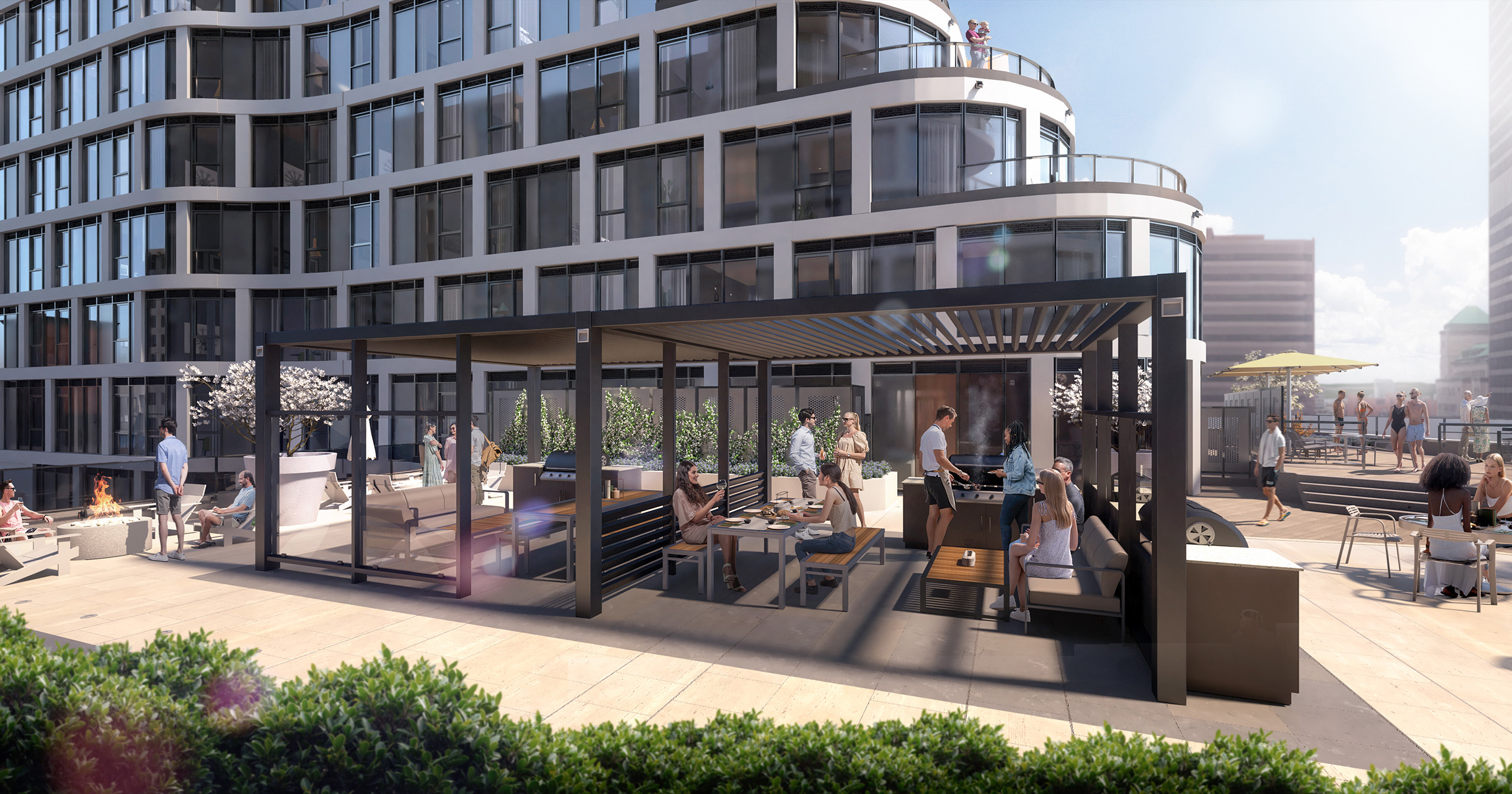 Rooftop terrace at Relevé Common Area Exterior, showcasing modern design and city views with seating and greenery.
